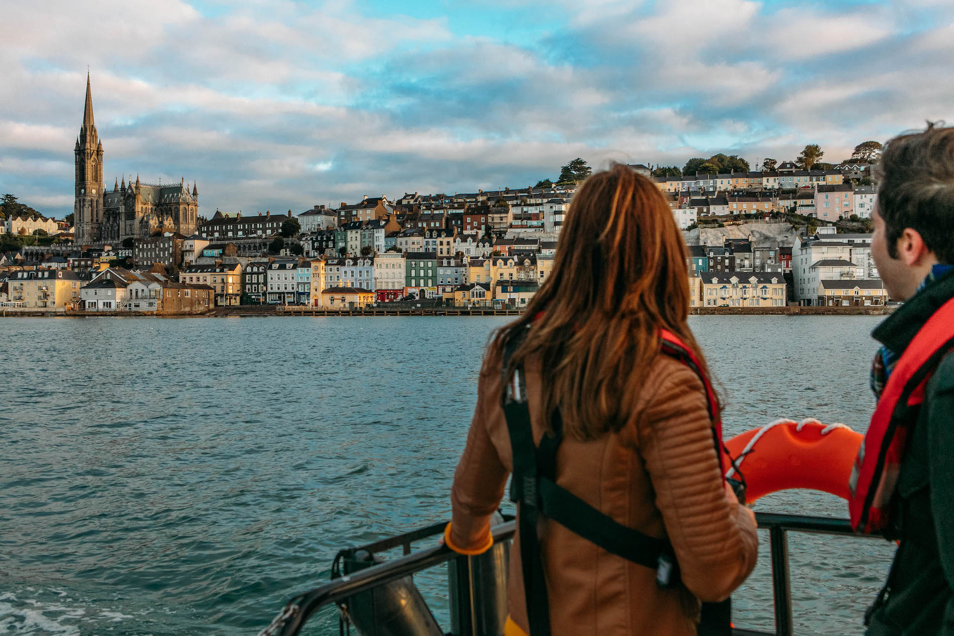 Colourful harbour houses and St Colman’s Cathedral overlooking Cobh, County Cork.