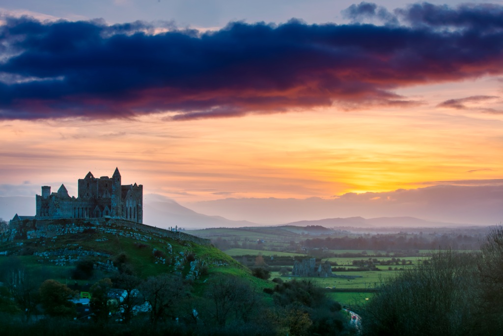 The Rock of Cashel silhouetted at sunset in County Tipperary.