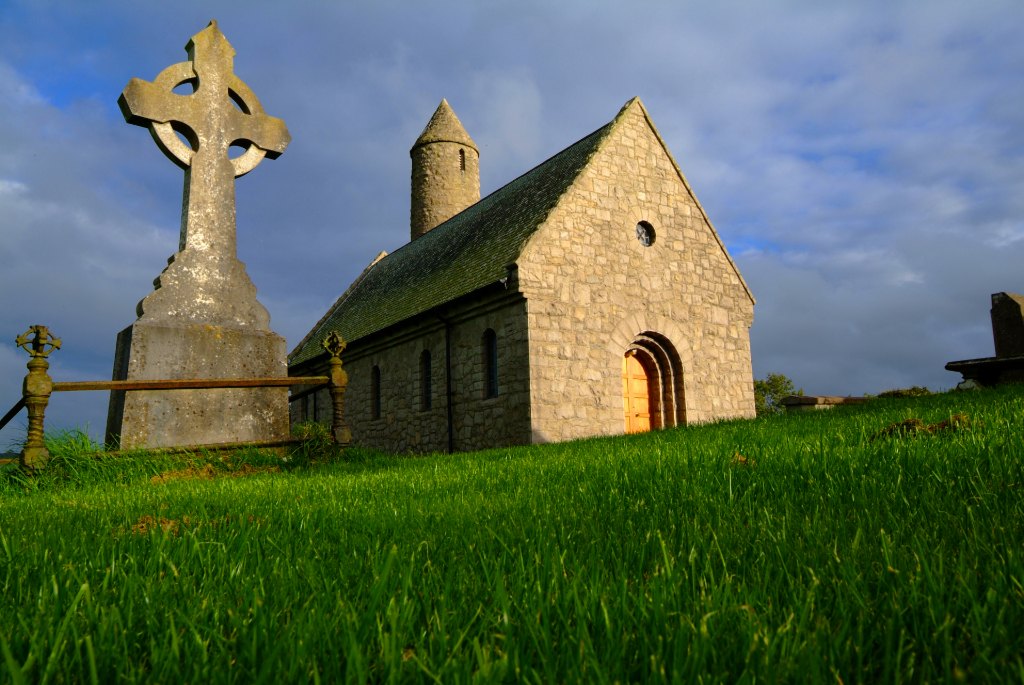 Ancient stone church and Celtic cross at Saul, County Down.