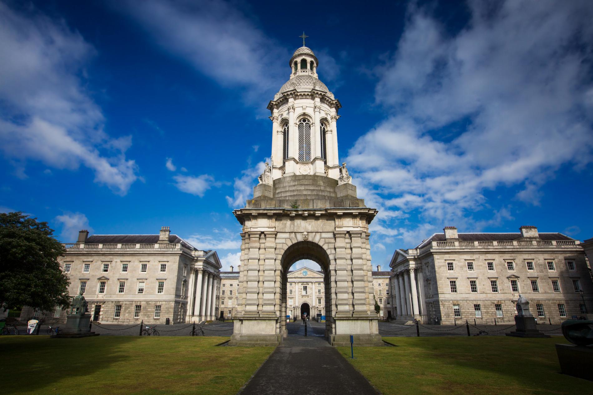 Trinity College Dublin Campanile under a blue sky.
