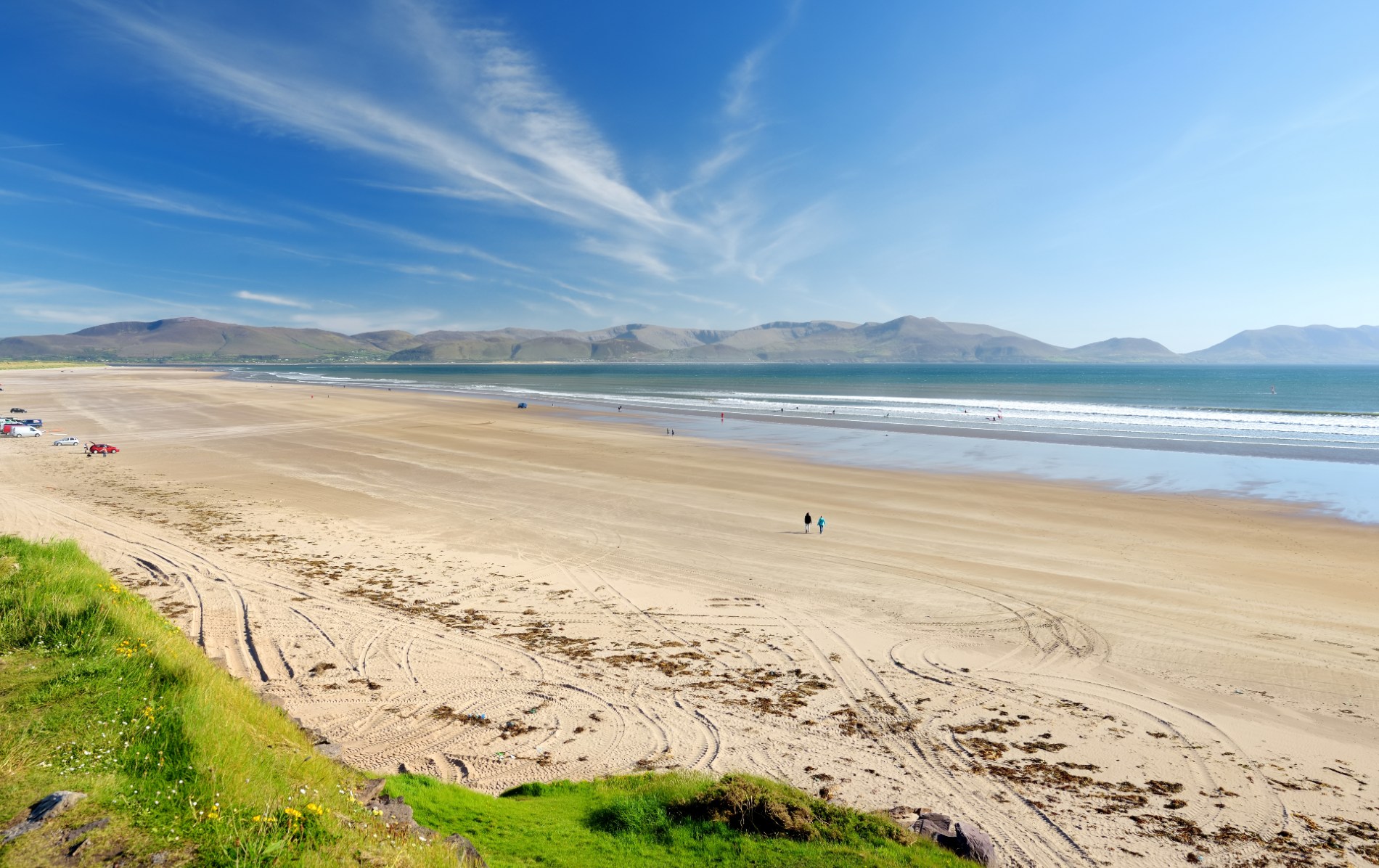 Wide sandy Inch Beach on the Dingle Peninsula, County Kerry, with mountains in the distance.