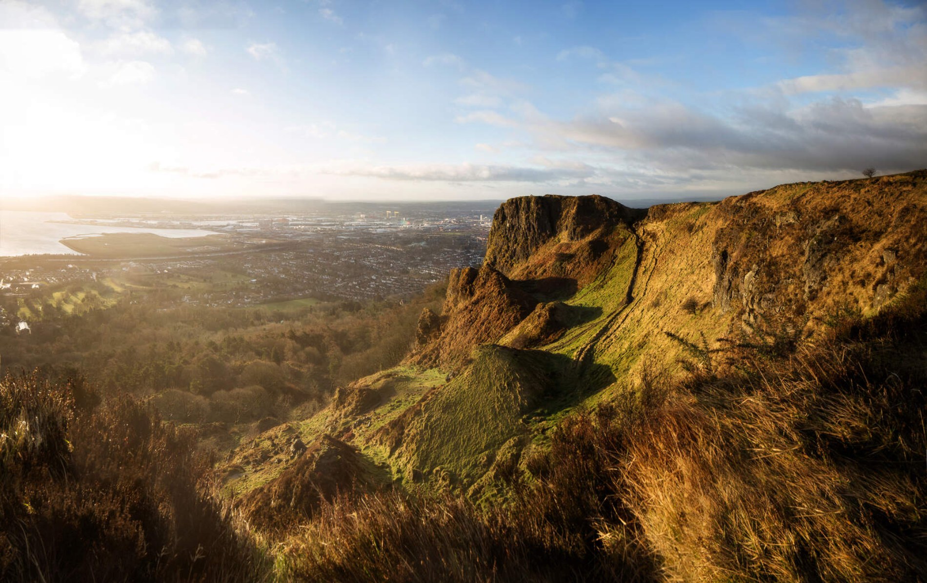 View over Belfast City from Cave Hill cliffs under a dramatic sky, County Antrim.