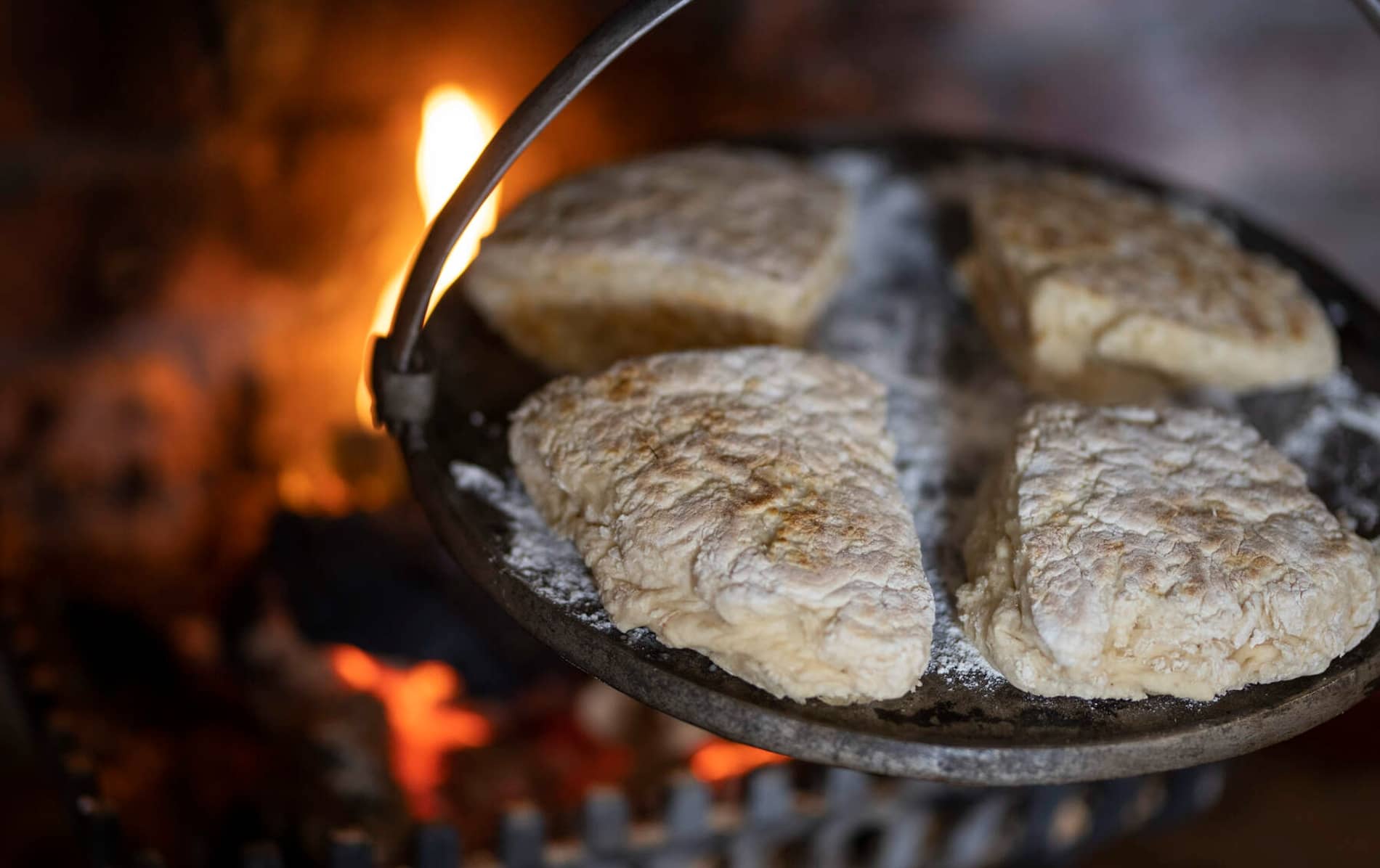 Traditional Irish soda farls cooking on a griddle over an open fire in County Fermanagh.