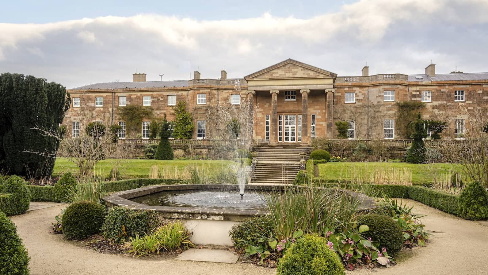 Hillsborough Castle with Georgian façade, formal gardens and central fountain in County Down.