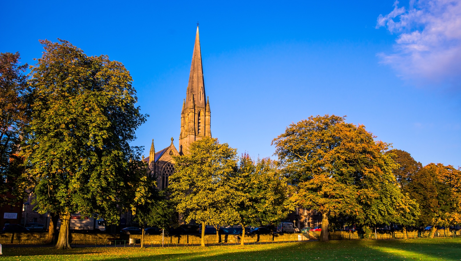 The Mall in Armagh city with tree-lined paths and the McClintock Monument.