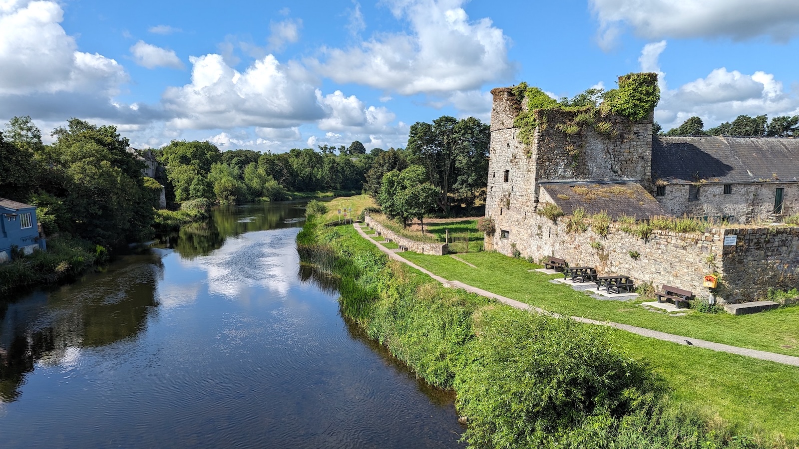 Sweetman Castle beside the River Nore with riverside path and greenery in Kilkenny.