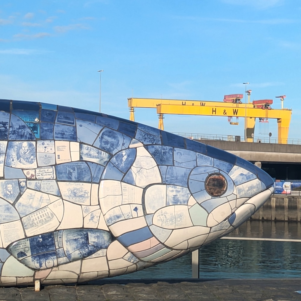 The Big Fish sculpture on the River Lagan in Belfast, with the Harland & Wolff cranes in the background.