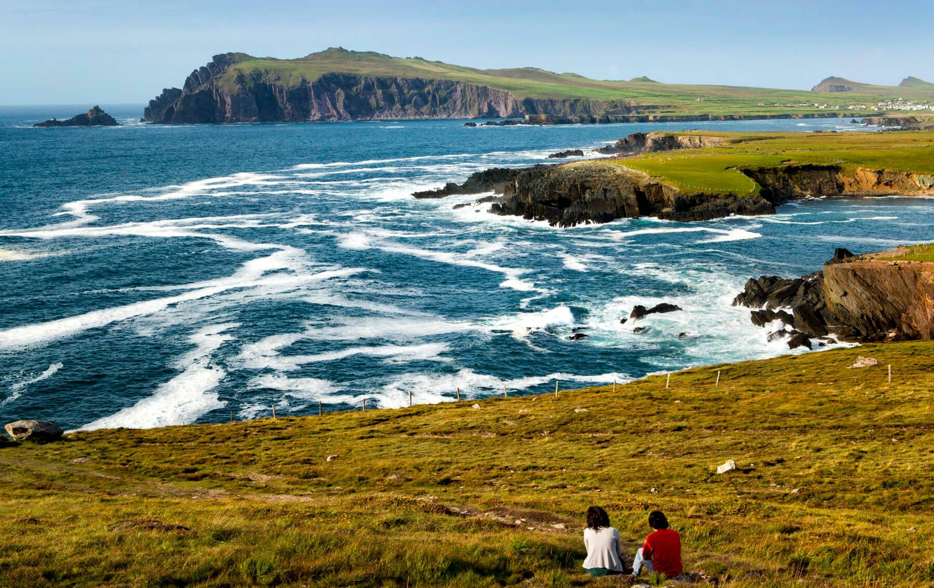 Clifftop view of waves crashing along rugged Dunmore Head in County Kerry.