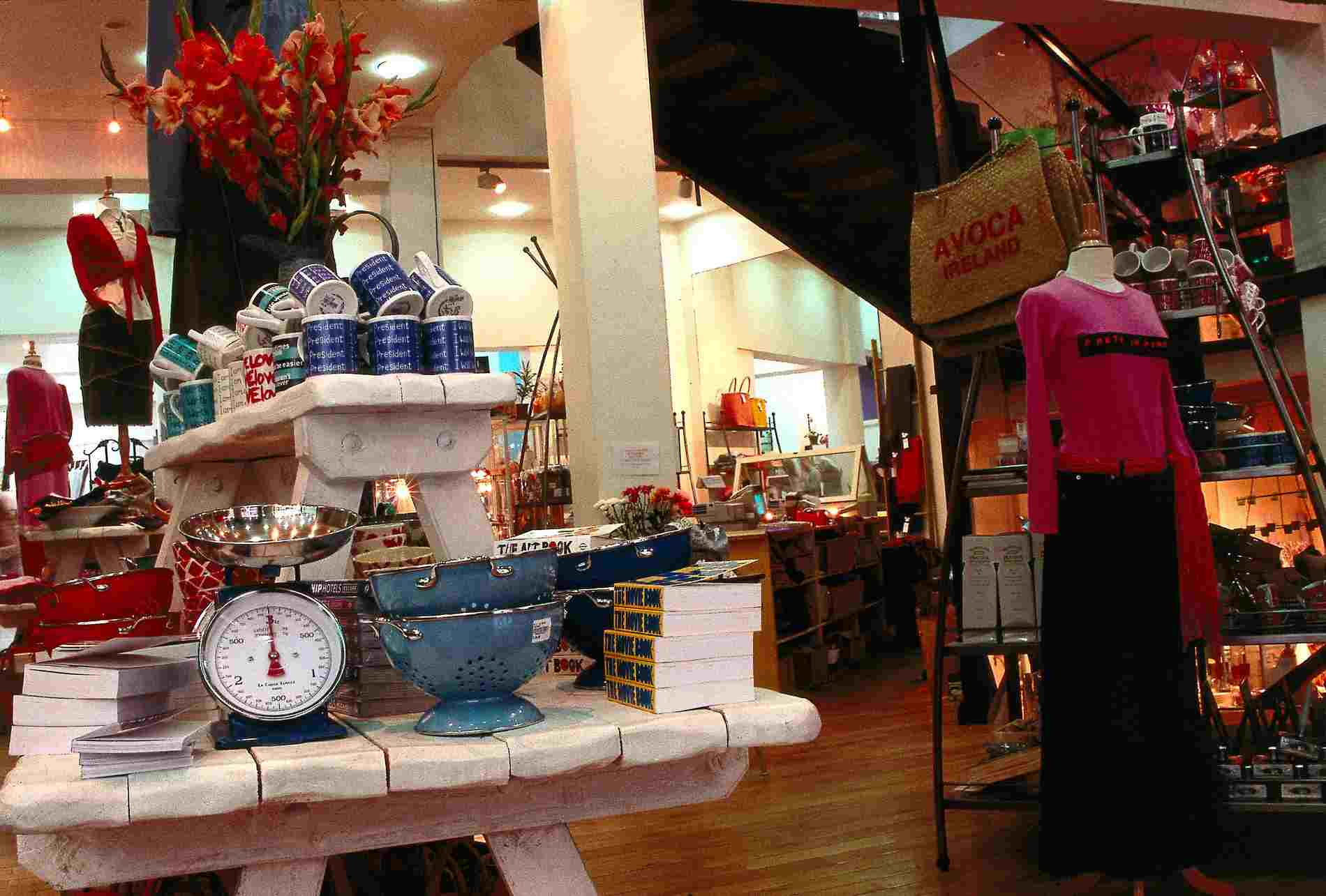 Eclectic display of mugs, colanders and colourful homeware in Avoca store on Suffolk Street, Dublin.