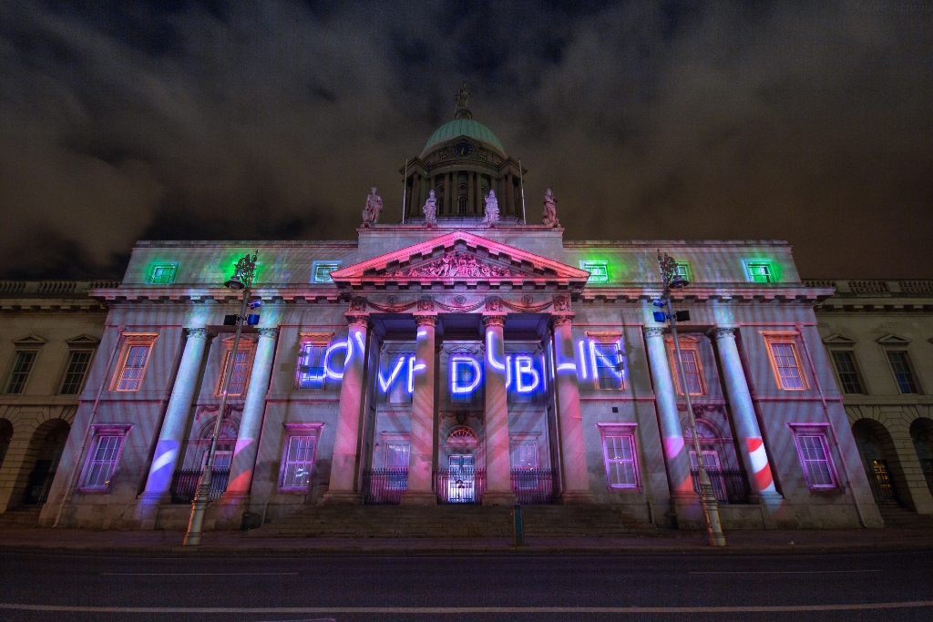 Custom House in Dublin lit up at night with ‘Love Dublin’ projection for New Year's Festival.