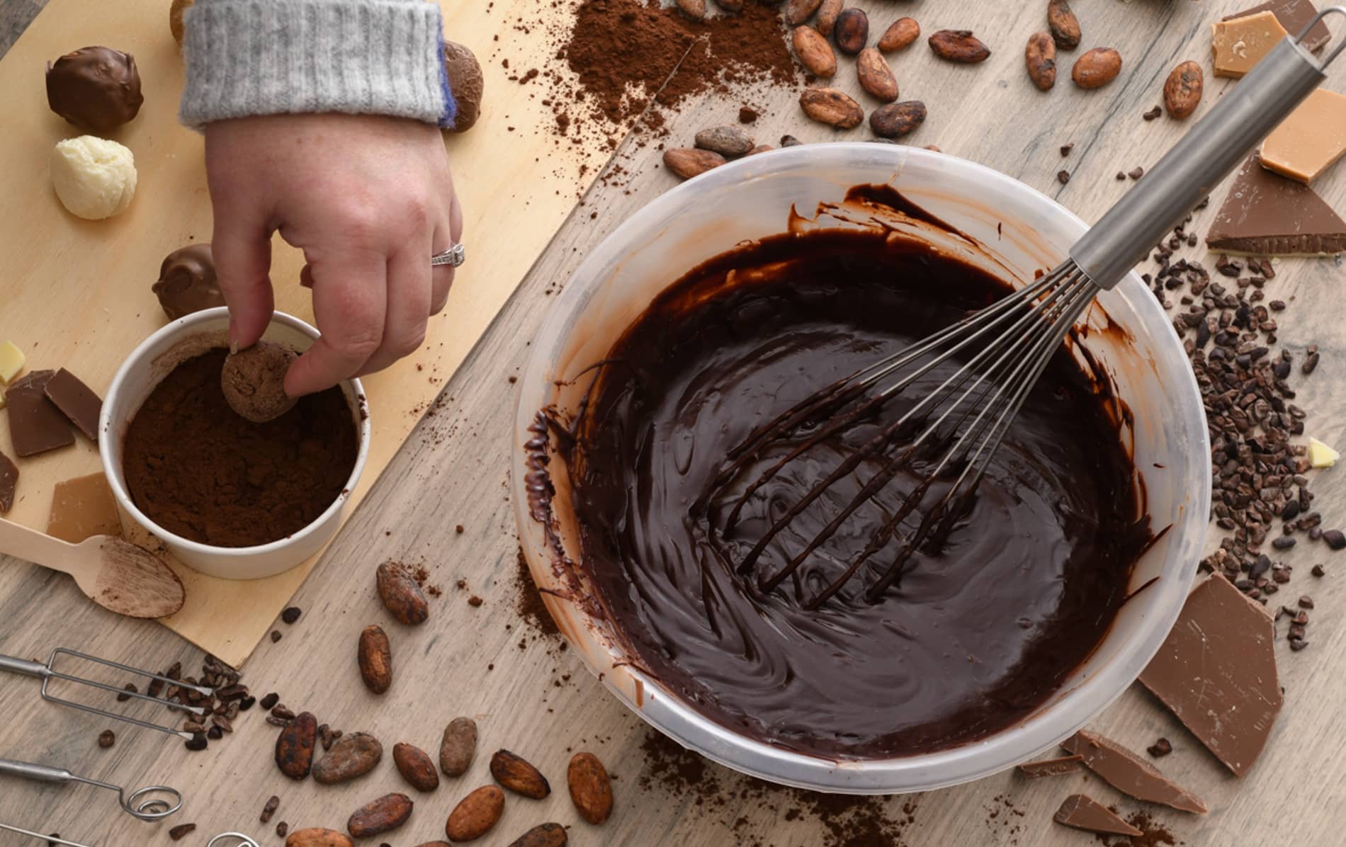 Chocolate truffle making with cocoa powder, melted chocolate and cocoa beans at The Chocolate Manor.