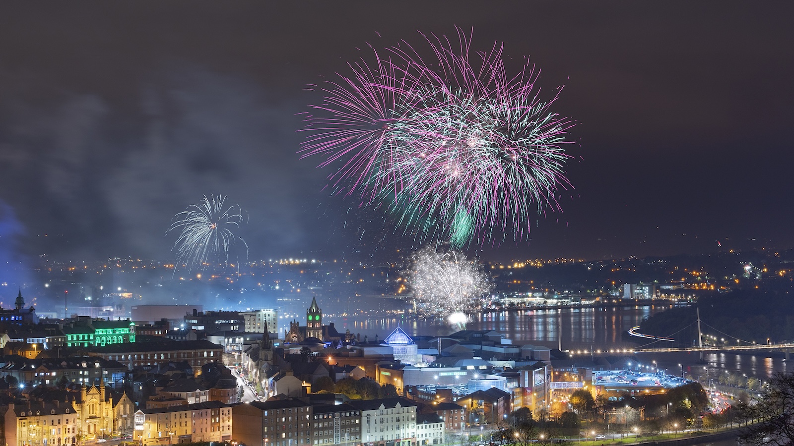 Colourful fireworks burst above Derry~Londonderry during Derry Halloween.