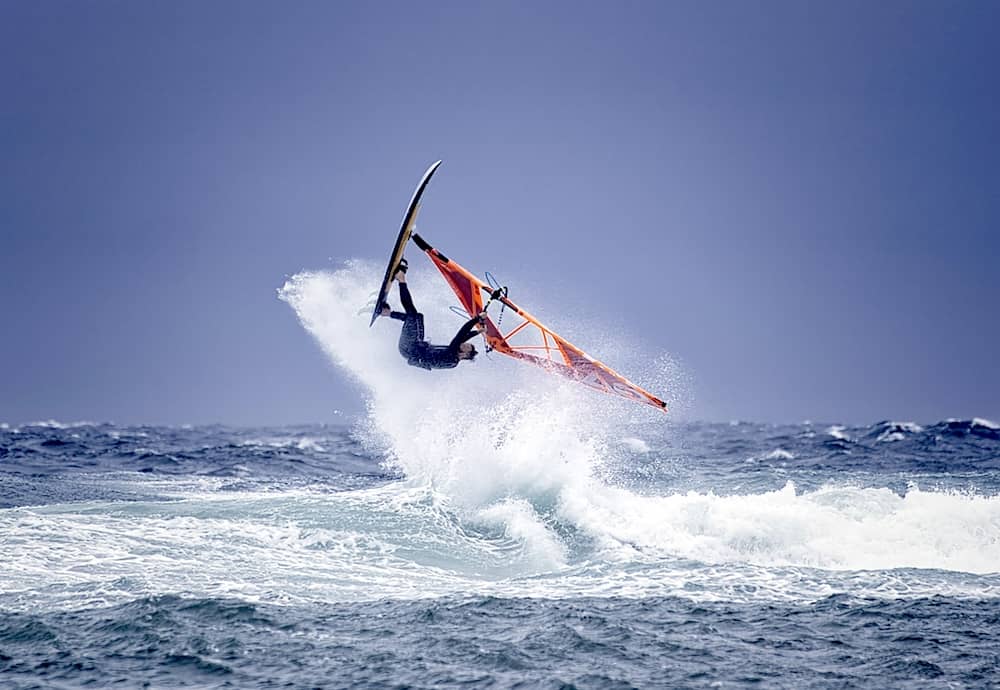 Windsurfer catching a wave off Fanore Beach on Ireland’s Wild Atlantic Way, County Clare.