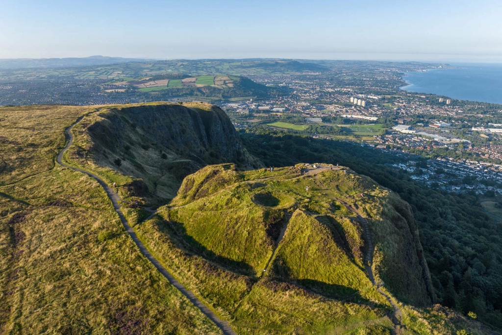 Walking trails curve along Cave Hill’s ridge with panoramic views over Belfast and the distant coastline.