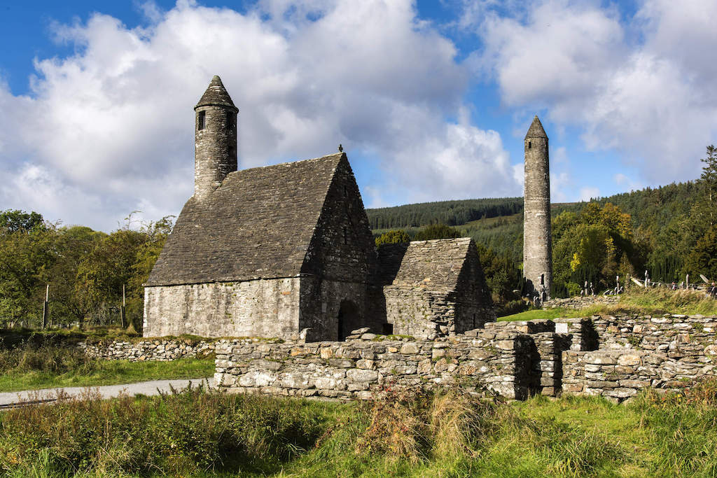 Ruins of Glendalough’s stone church and round tower in County Wicklow, Ireland.