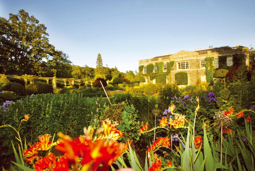 Historic estate with vibrant summer blooms and formal garden layouts.