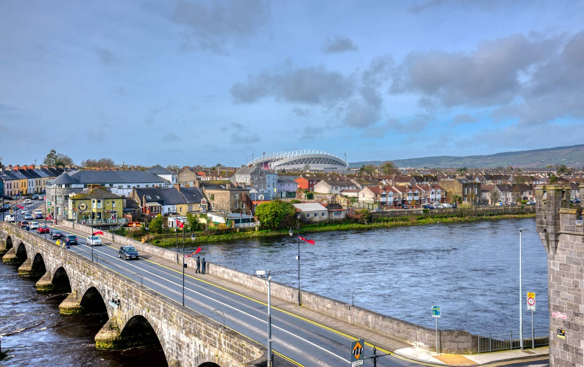 Aerial view of Limerick city with Thomond Park stadium visible beyond the rooftops.