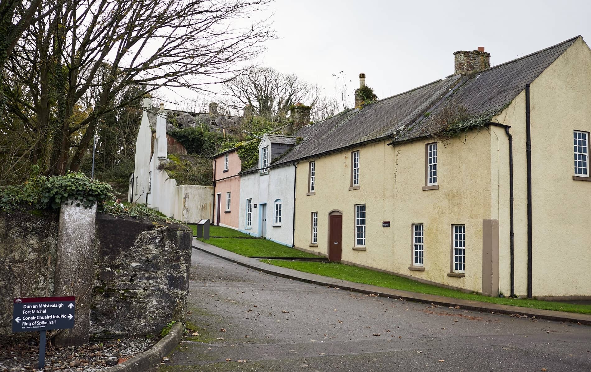 Row of pastel and cream-coloured houses along a quiet street on Spike Island.