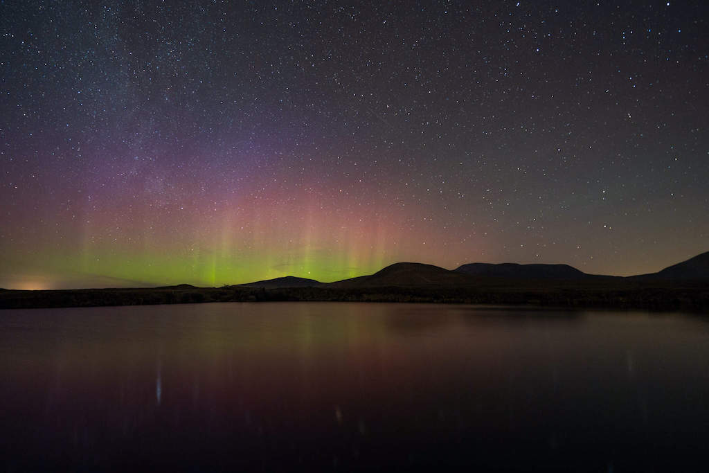 Northern Lights glowing in the night sky over Mayo Dark Sky Park in County Mayo.