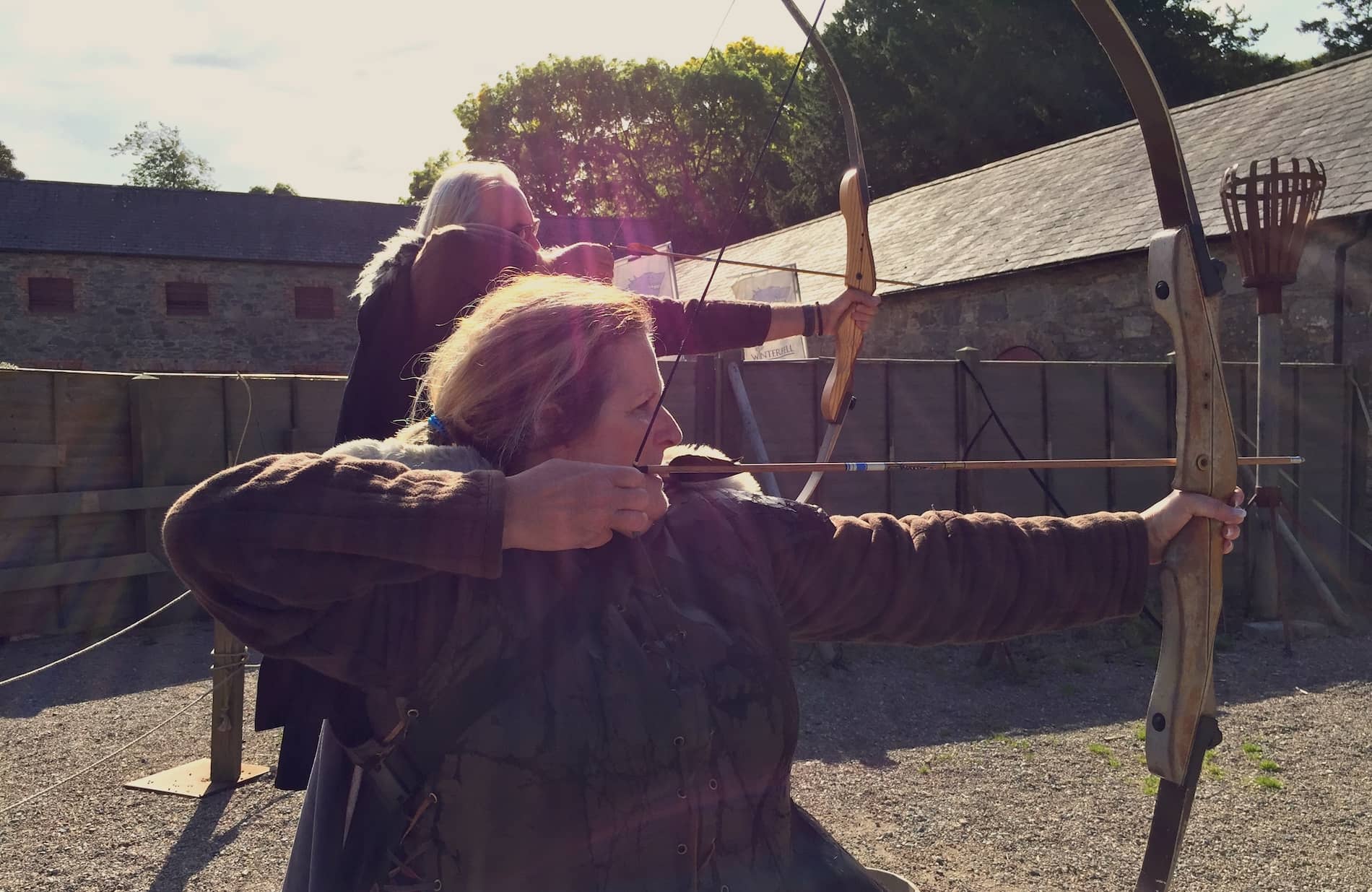 Visitors in costume practice archery at Winterfell film location in County Down.