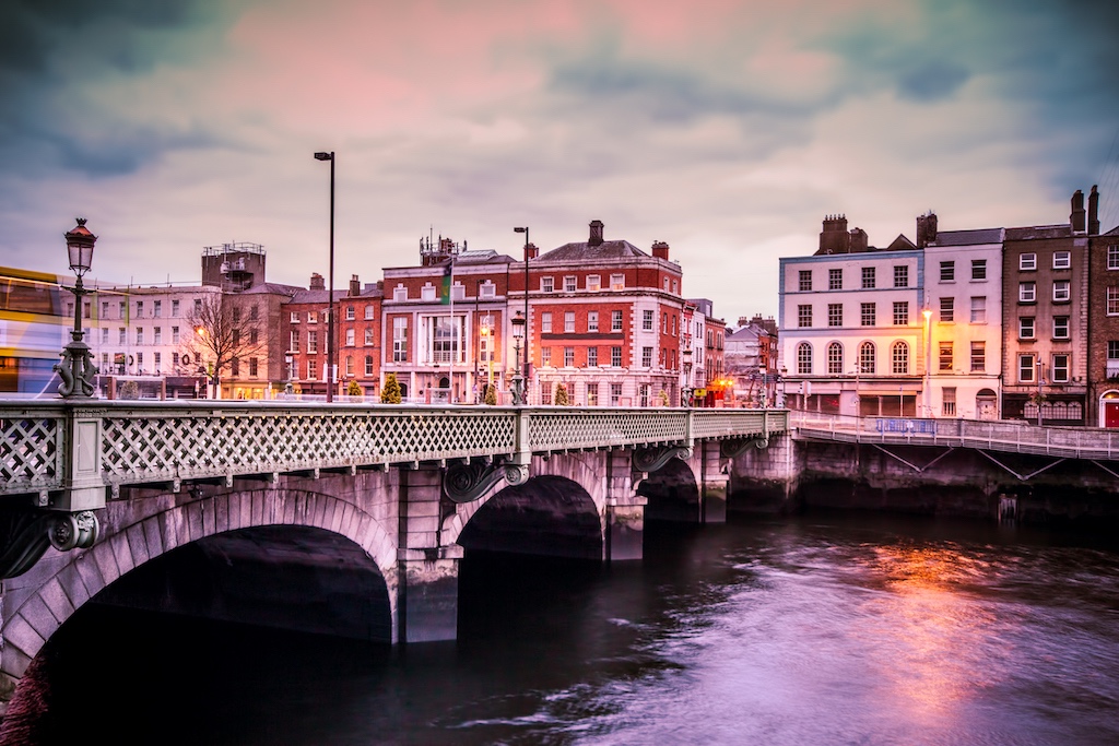 View of Grattan Bridge over the River Liffey with Georgian buildings at dusk in Dublin.