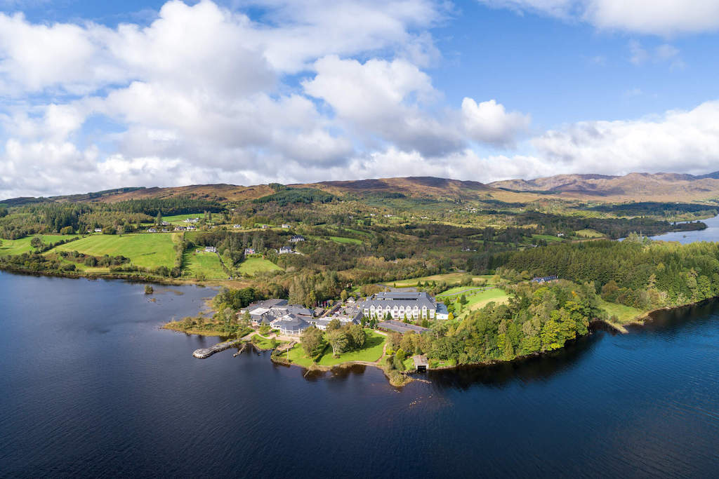 Aerial view of Lough Eske and surrounding hills with Harvey’s Point hotel in Donegal.