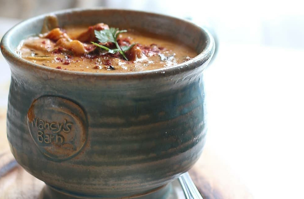 Seafood chowder served in a rustic ceramic bowl from Nancy’s Barn in Donegal.
