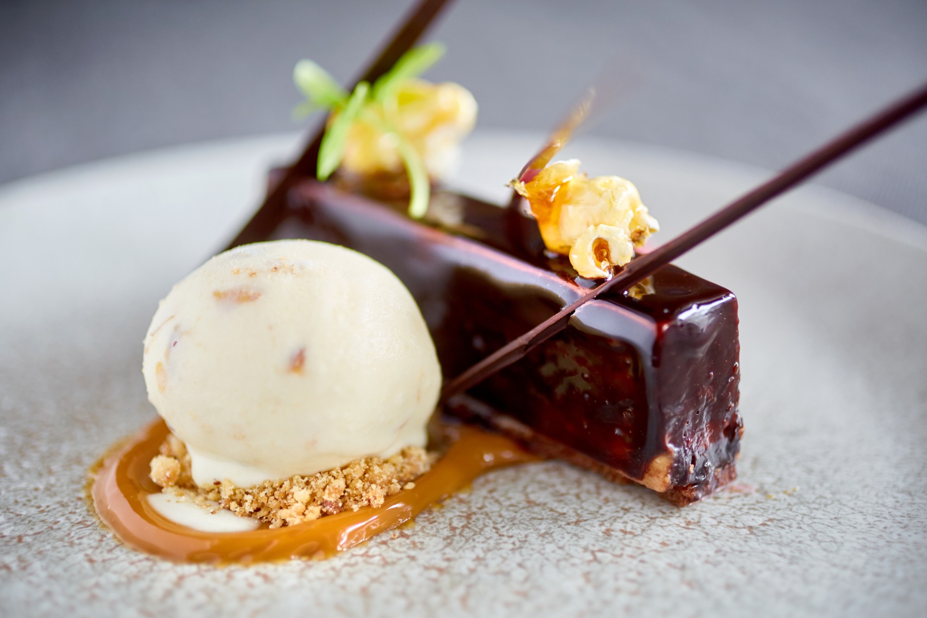 Gourmet dessert of chocolate cake with caramel popcorn and ice cream served in Donegal.
