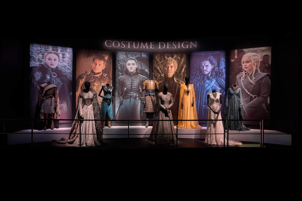 Game of Thrones costume display with character outfits and portraits at the Game of Thrones® Studio Tour in County Down.
