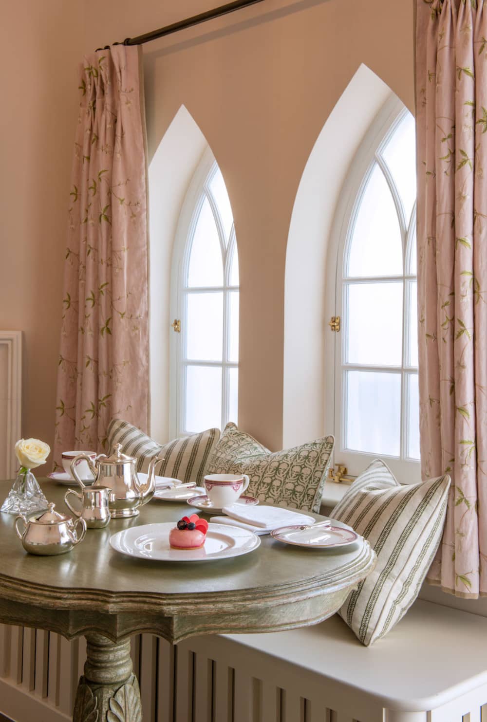 Elegant afternoon tea for two at a window nook in the Cashel Palace Hotel, County Tipperary, with vintage decor and fine china.