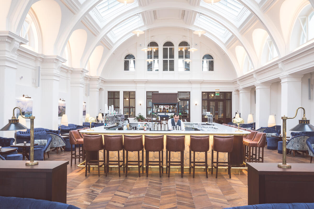 Bar beneath the vaulted atrium at Titanic Hotel Belfast in the Titanic Quarter.