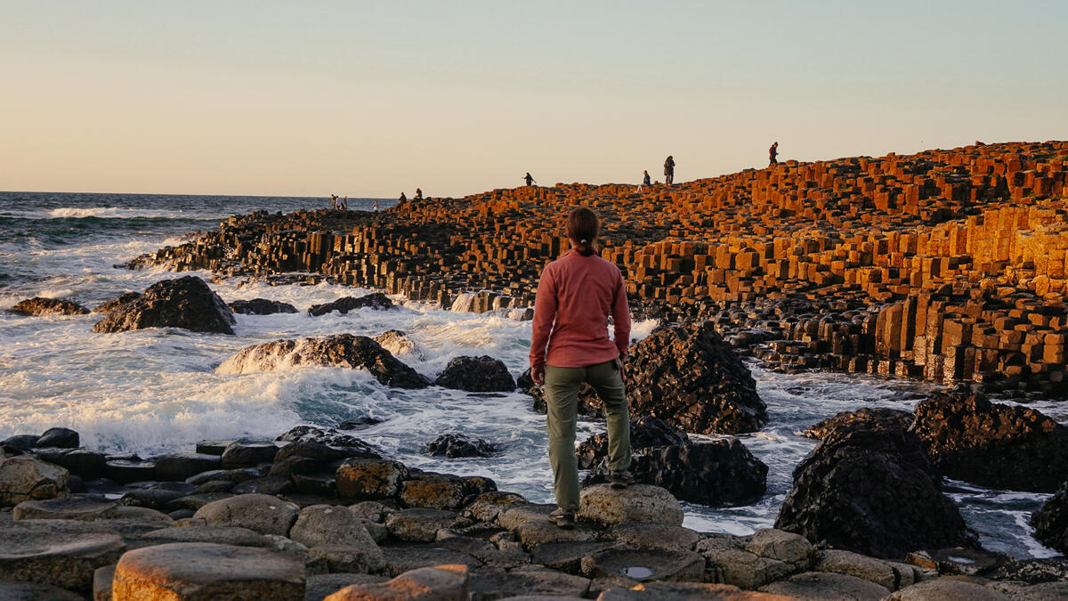 Person standing among the basalt columns of the Giant's Causeway, County Antrim.