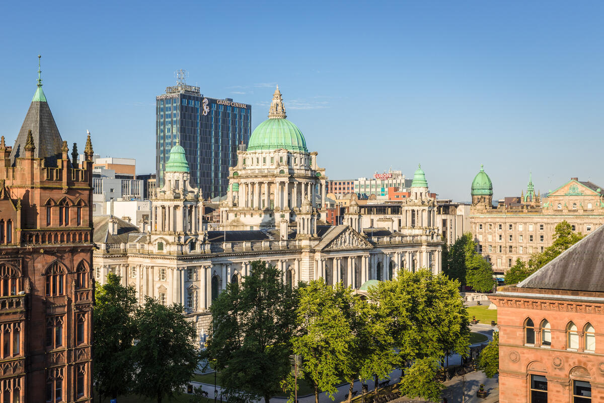 Belfast City Hall viewed across the city centre with the Grand Central Hotel behind.