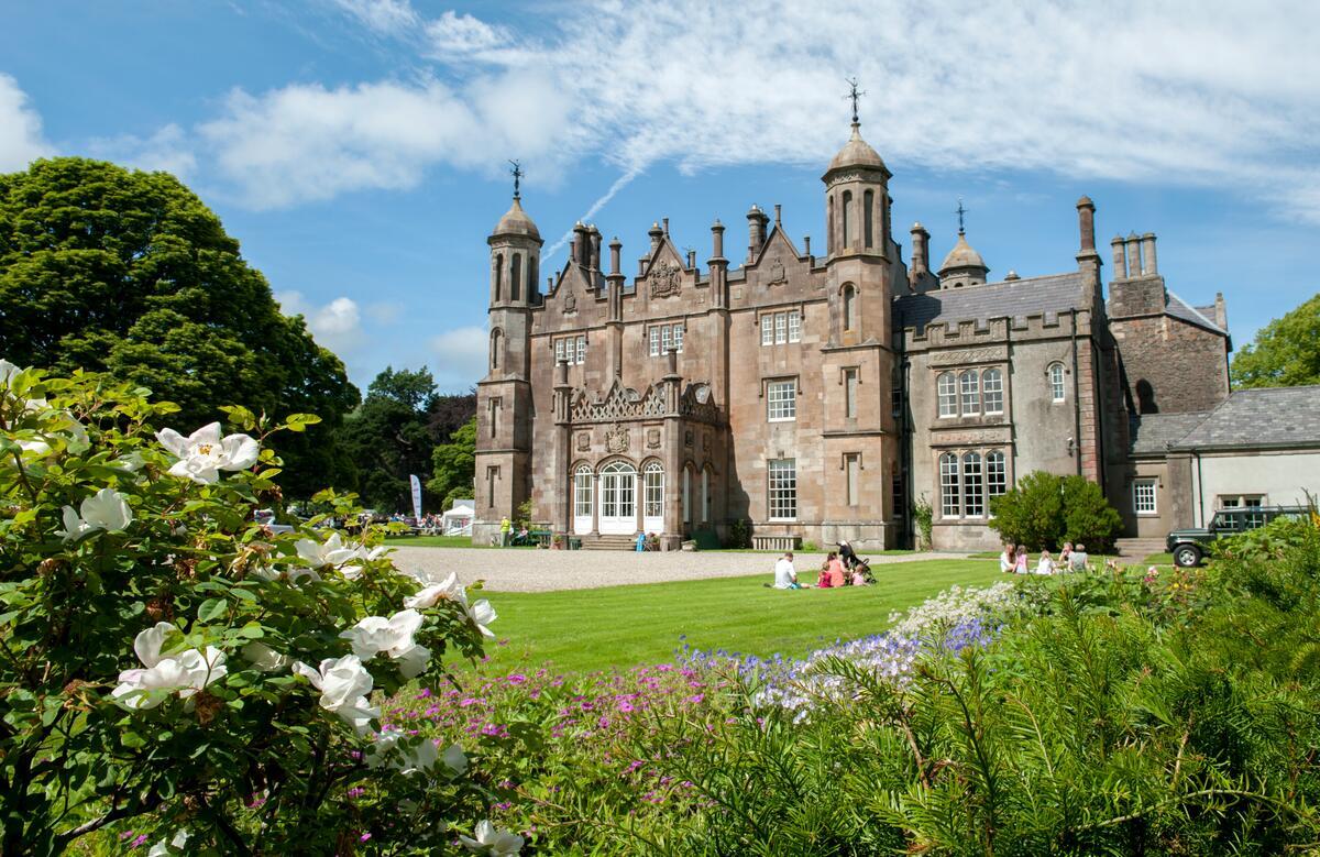 Glenarm Castle surrounded by colourful gardens in Glenarm, County Antrim.