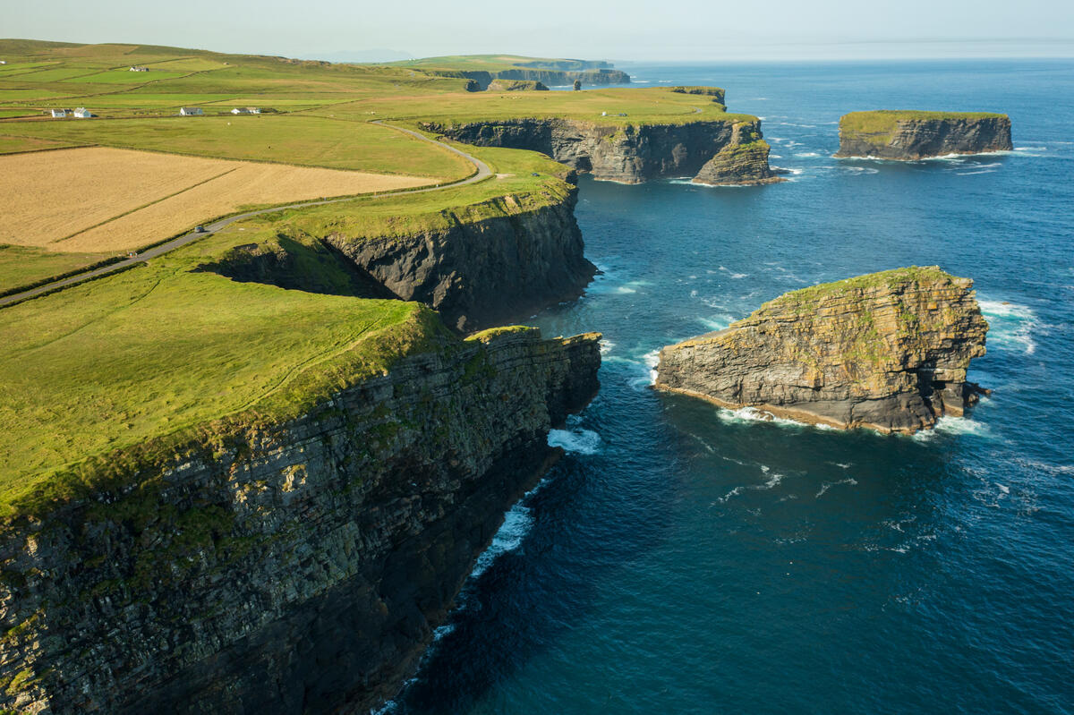 Waves crash against the Kilkee Cliffs on the Wild Atlantic Way in County Clare.