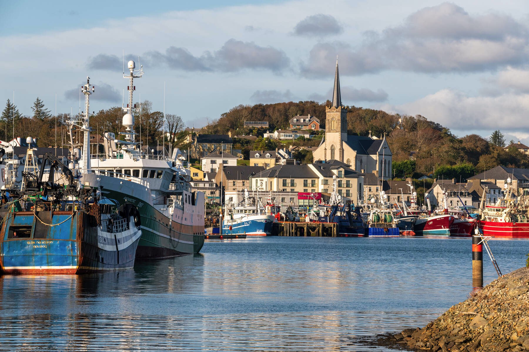 Colourful fishing boats docked in the harbour at Killybegs, County Donegal.