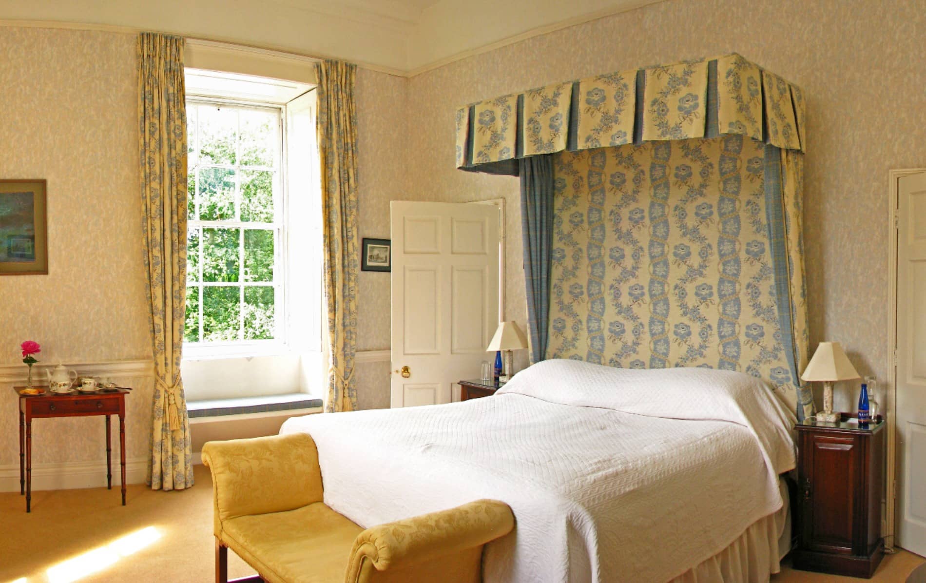 Classic bedroom with canopied bed at Coopershill House, County Sligo.