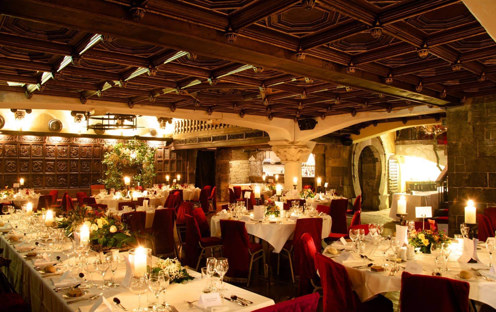 Candlelit medieval banquet hall at Belleek Castle, County Mayo.