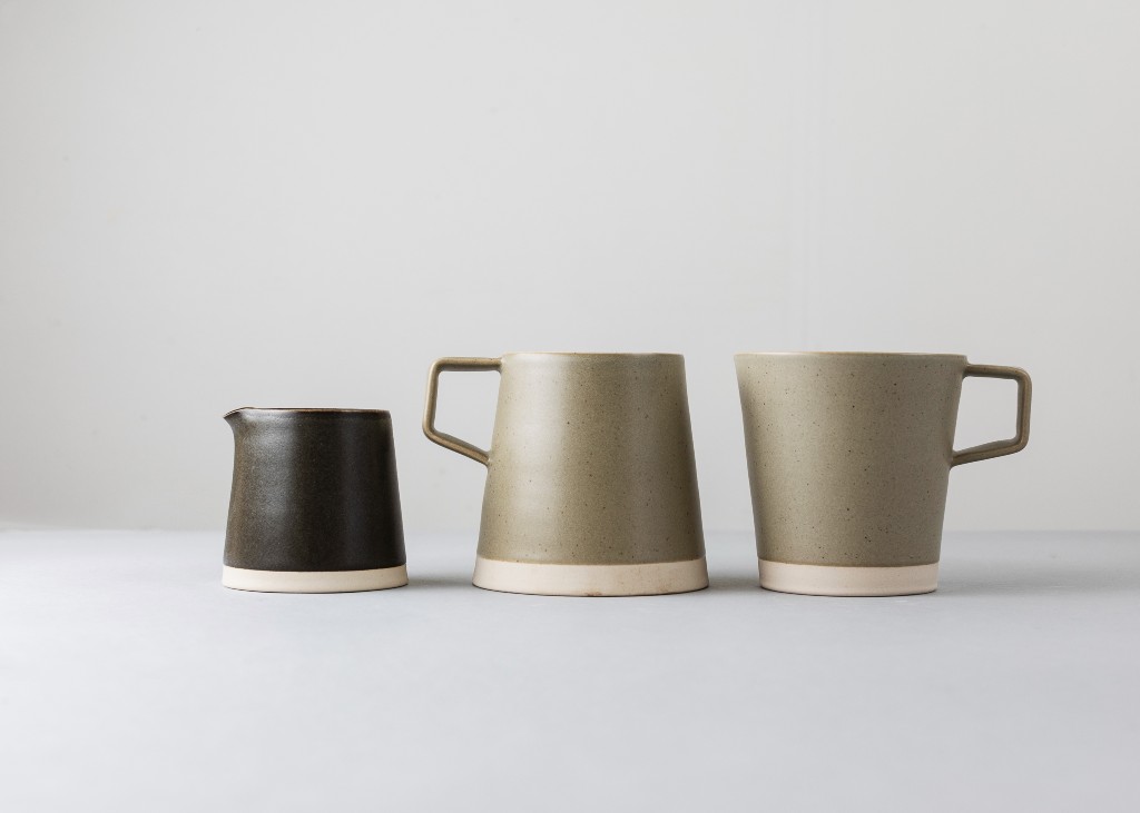 Set of three minimalist ceramic mugs and a pourer from Arran Street East on a neutral background.