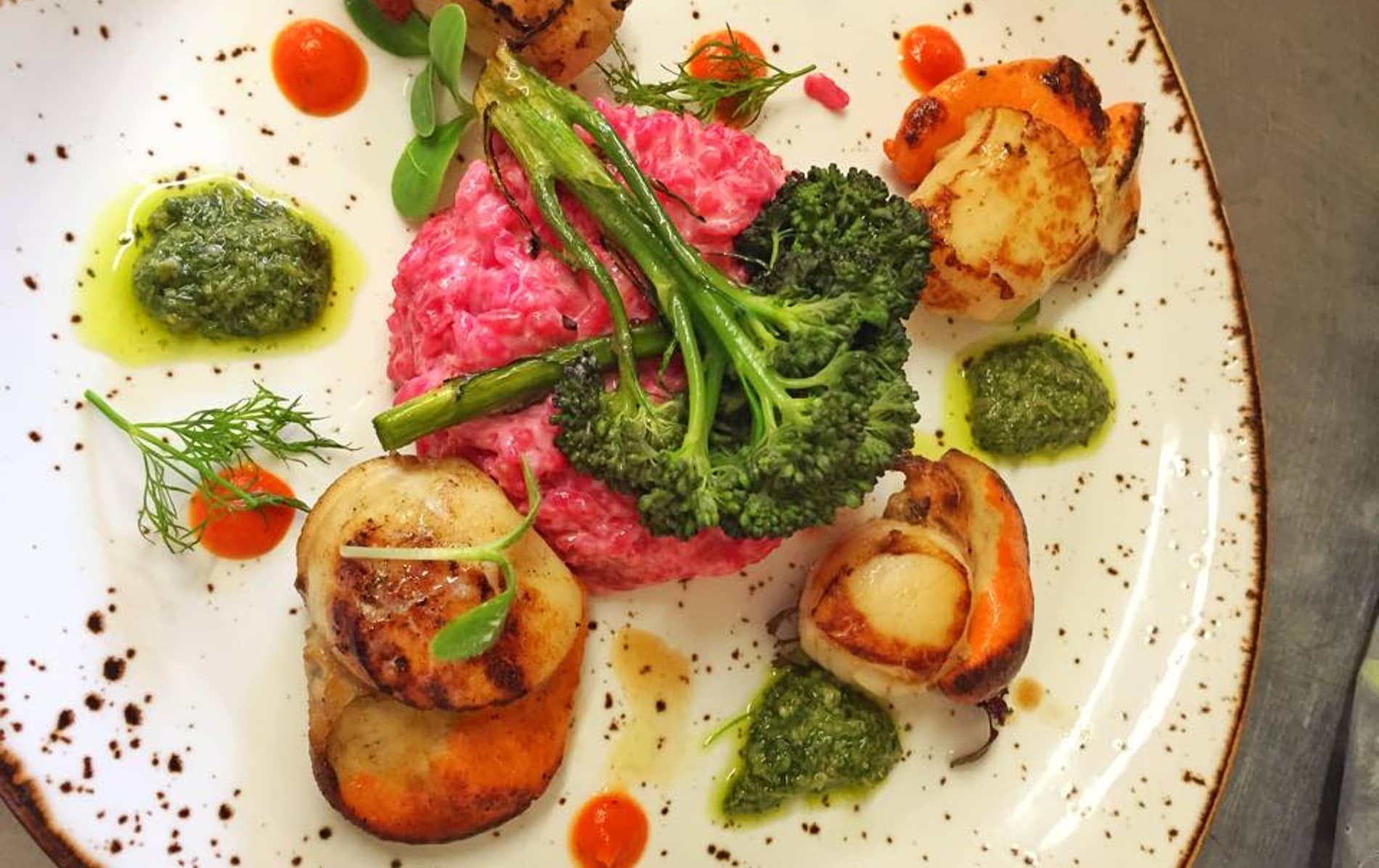 Colourful dish of scallops, beetroot risotto and broccoli served at the Bulman pub in Kinsale, County Cork.