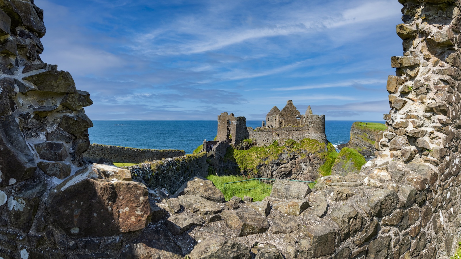 Dunluce Castle standing high on rugged cliffs along Northern Ireland’s coastline.