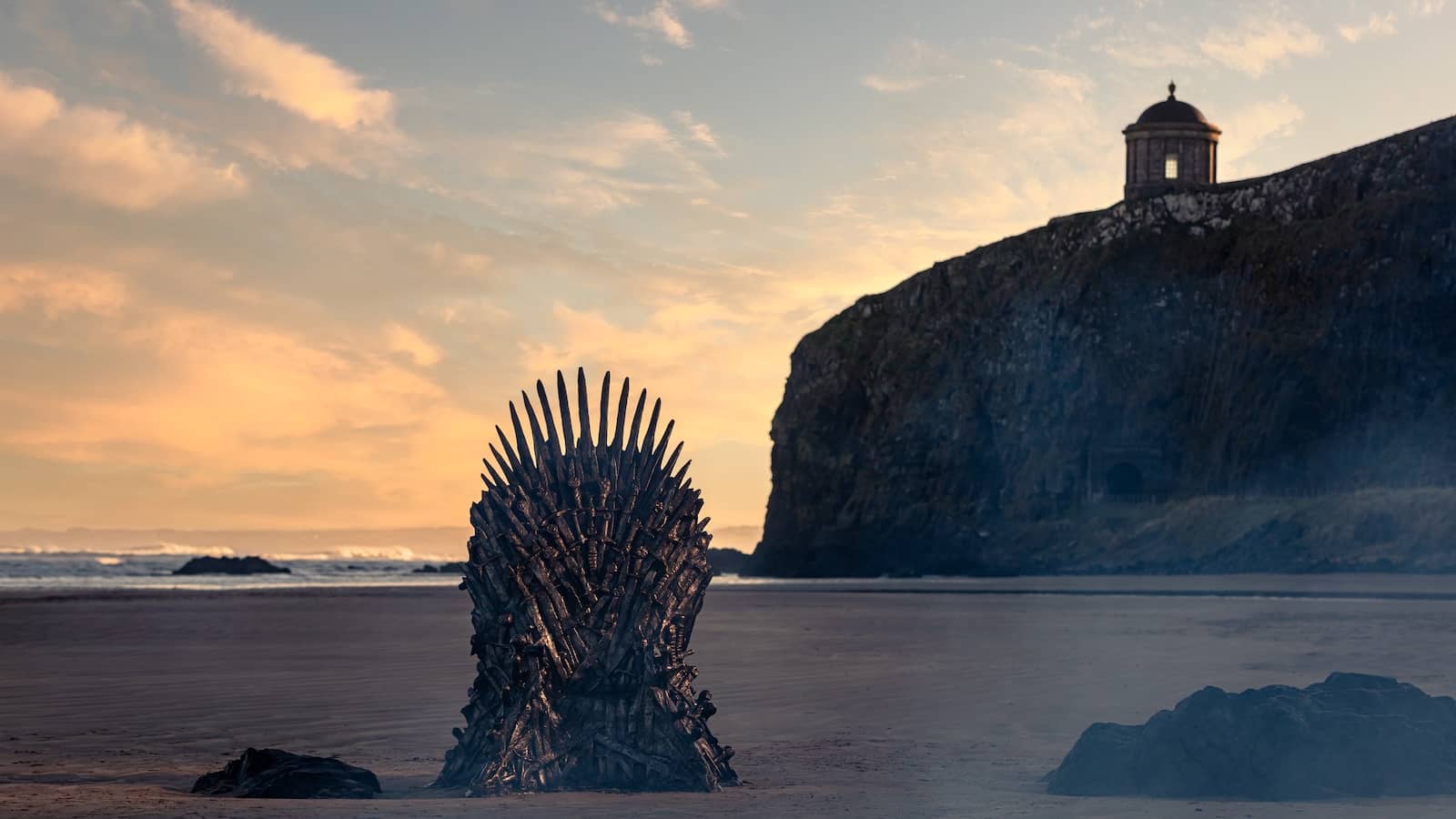 The Iron Throne on Downhill Beach at sunset with Mussenden Temple on the cliff above, County Londonderry.