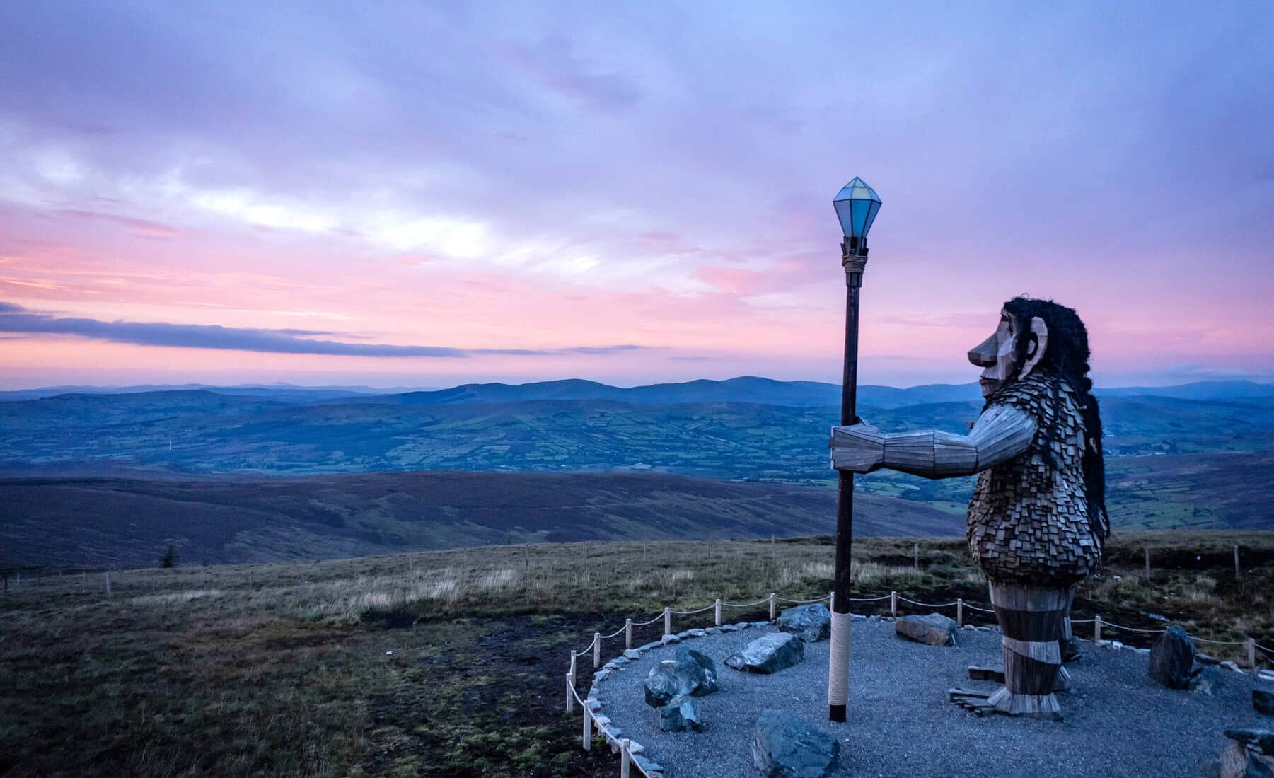 The Sperrins Giant sculpture overlooks the Sperrin Mountains at sunset in County Tyrone.