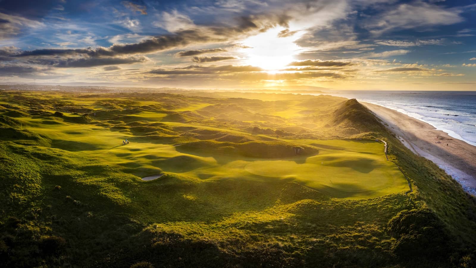 Royal Portrush Golf Club in County Antrim with coastal links and lighthouse on the Atlantic coast.