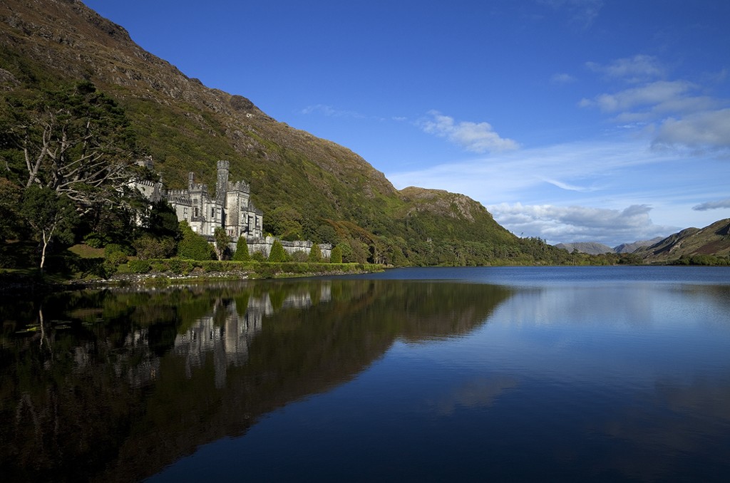 Kylemore Abbey reflected in the still waters of Pollacapall Lough, Connemara.