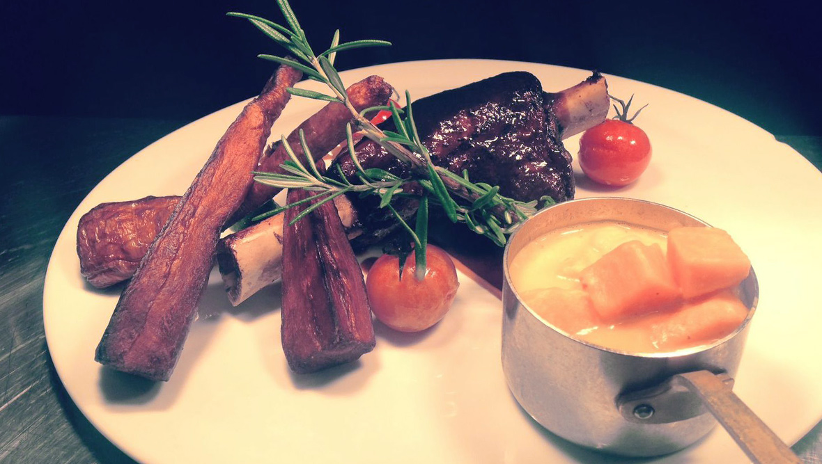 Gourmet dish of Slaney River lamb with vegetables and sauce at The Vintage Kitchen in Dublin.