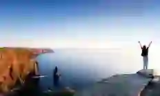 cliffs-of-moher-and-girl-with-out-stretched-arms