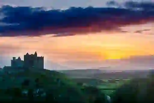 The Rock of Cashel silhouetted at sunset in County Tipperary.