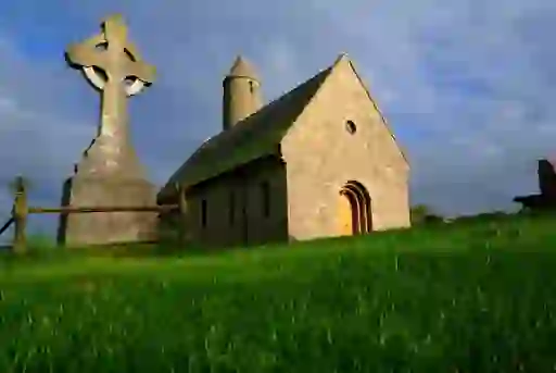 Ancient stone church and Celtic cross at Saul, County Down.