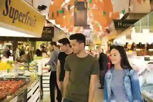 Young couple shopping for fresh produce at the English Market in Cork City.